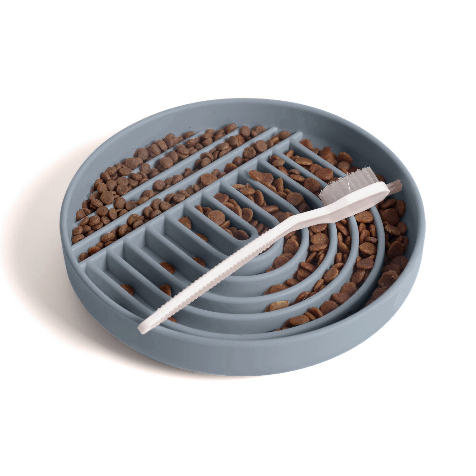 Charcoal silicone dog slow feeder bowl filled with kibble and cleaning brush