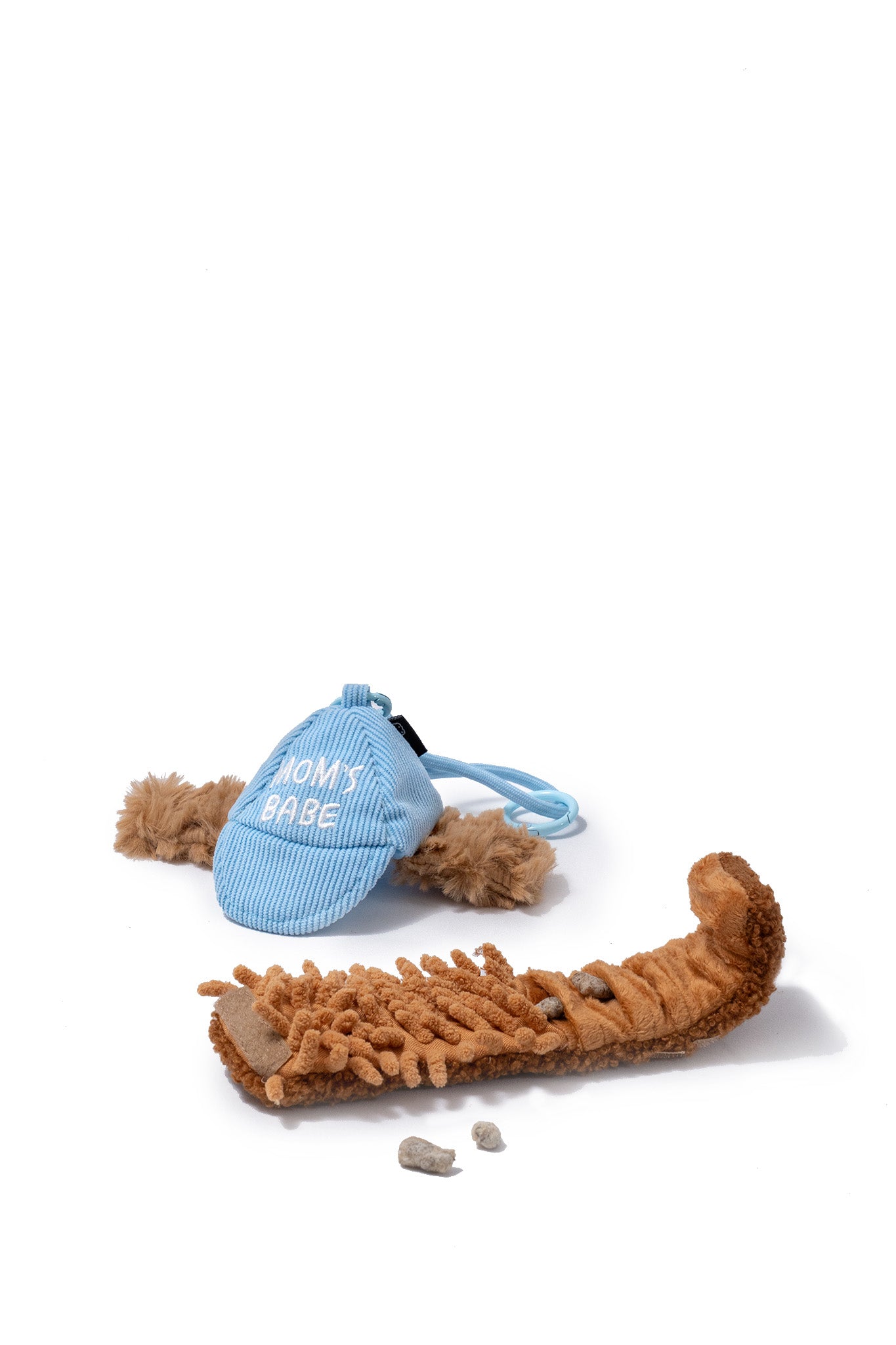 Blue CLIK Pup Charm opened to show layered textures and hidden treat pockets for sniff-led dog enrichment.