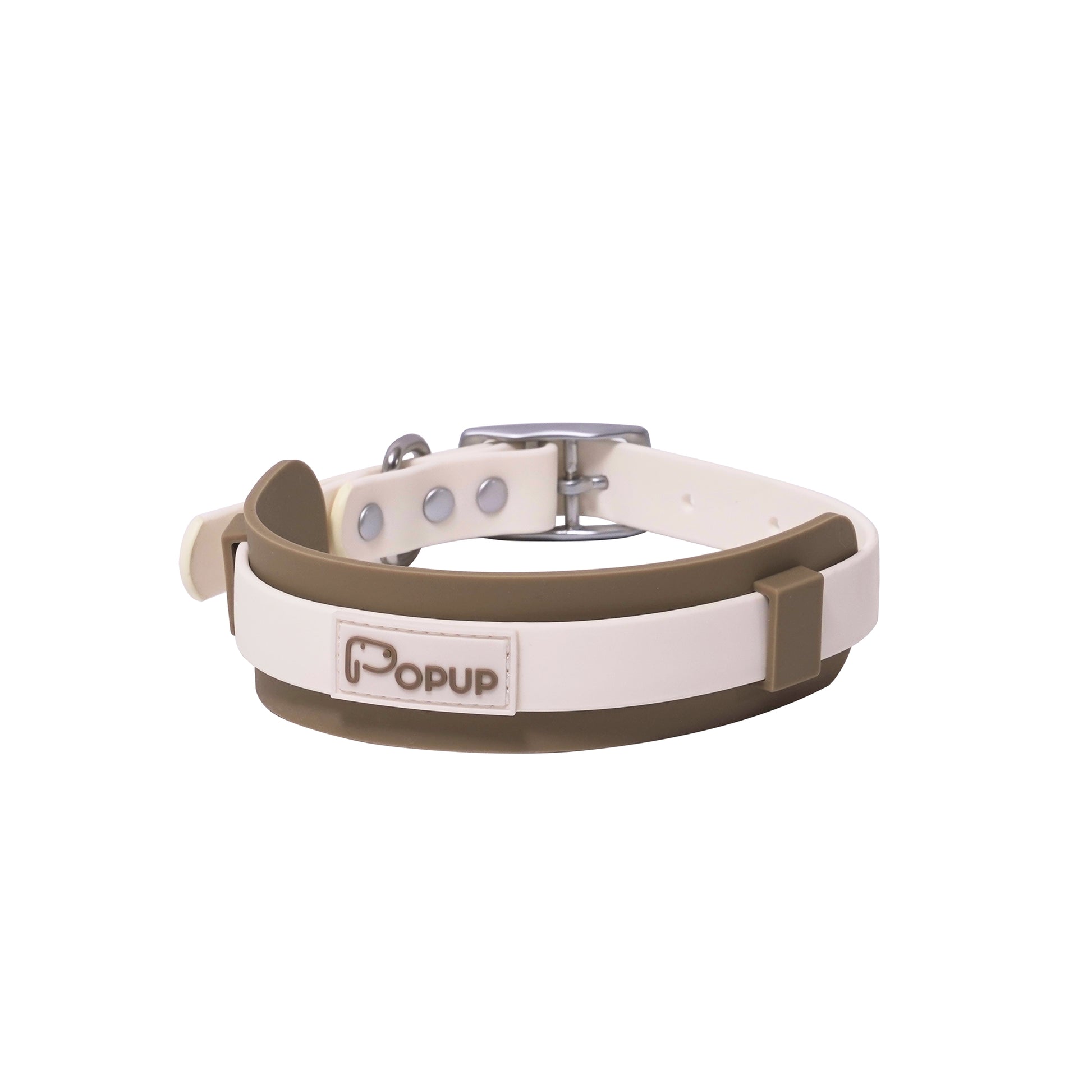 Close-up of waterproof PVC dog collar with wide silicone neck guard and metal buckle hardware