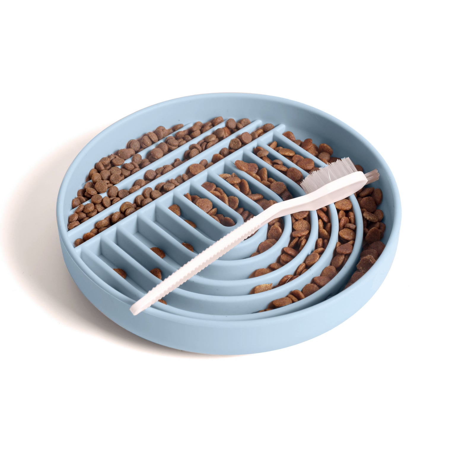 Leaden silicone dog slow feeder bowl filled with kibble and cleaning brush