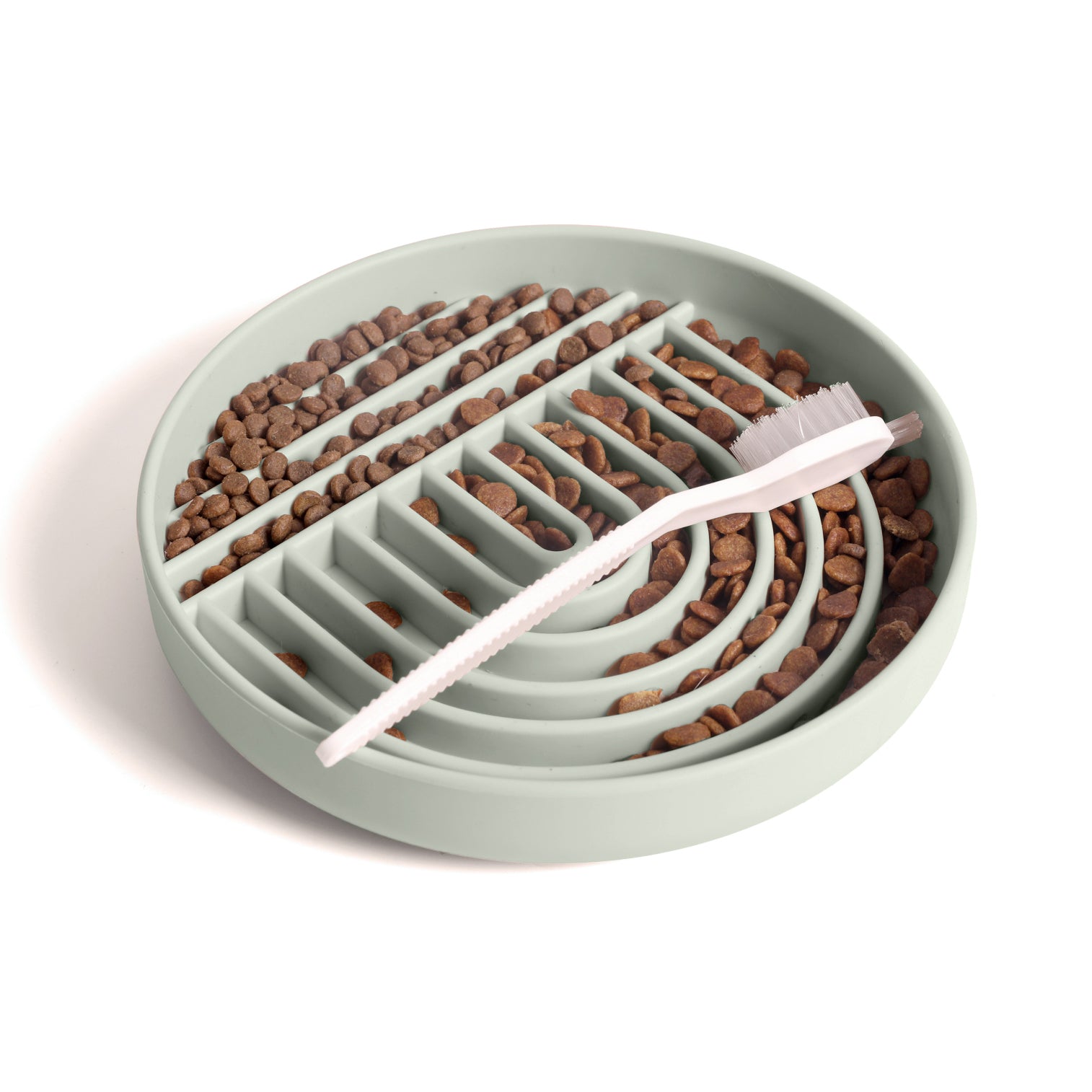 Sage silicone dog slow feeder bowl filled with kibble and cleaning brush